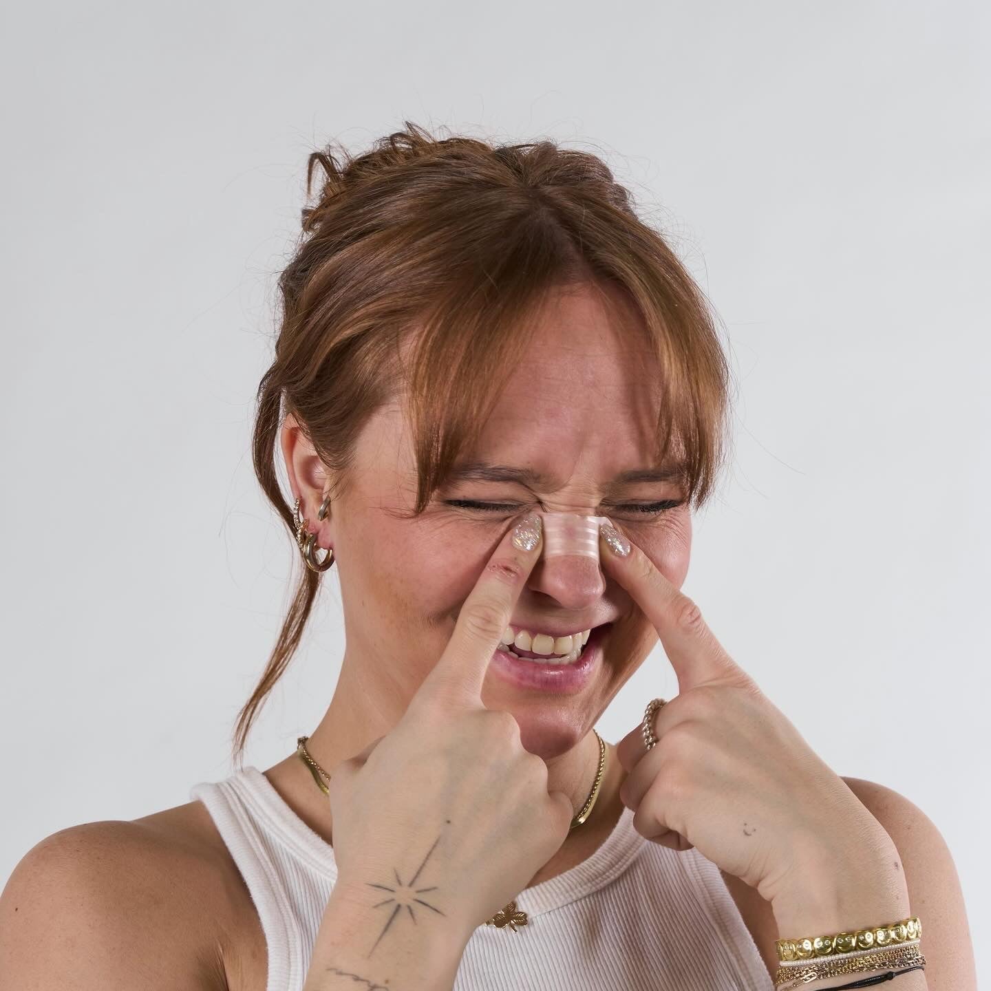 Woman applying Nasal Strip