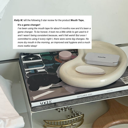 Mouth tape product on a shelf with a magazine and text overlay about a 5-star review.